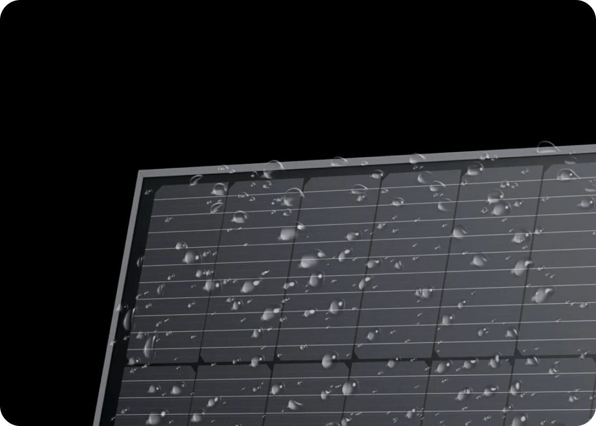 An EcoFlow rigid solar panel sporting an IP68 water and dustproof rating has water drops all over the surface.