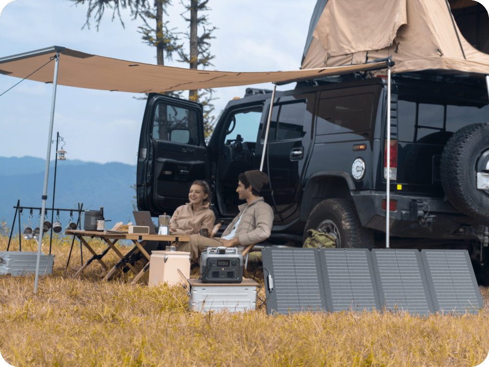 An EcoFlow 160W Portable Solar Panel is set up by its kickstand case, charging a RIVER 2 Max, next to two people and an SUV.