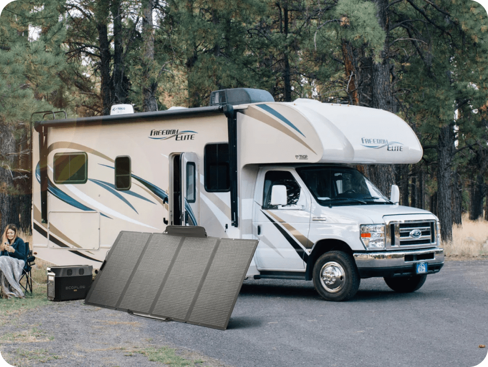 Next to an RV, an EcoFlow 400W Portable Solar Panel charges a DELTA Pro while a woman tops up her phone using the DELTA Pro.