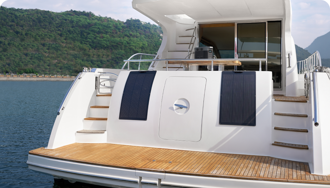 An EcoFlow 100W Flexible Solar Panel is mounted on a curved surface on a sailing yacht.