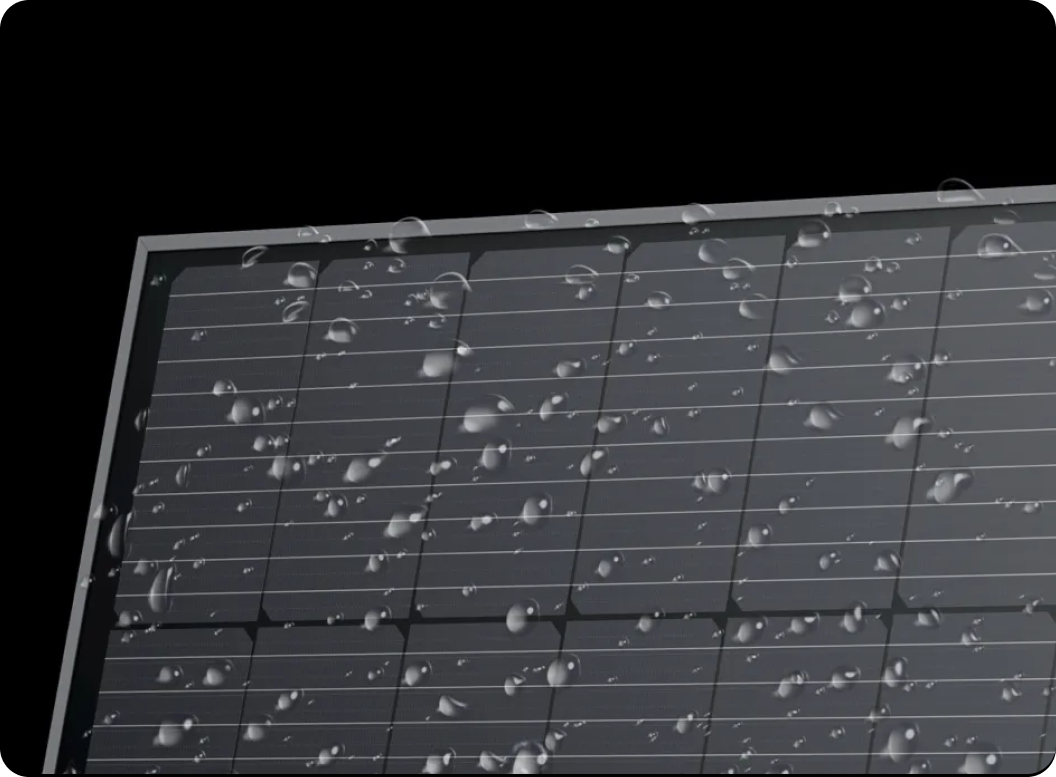 An EcoFlow rigid solar panel sporting an IP68 water and dustproof rating has water drops all over the surface.