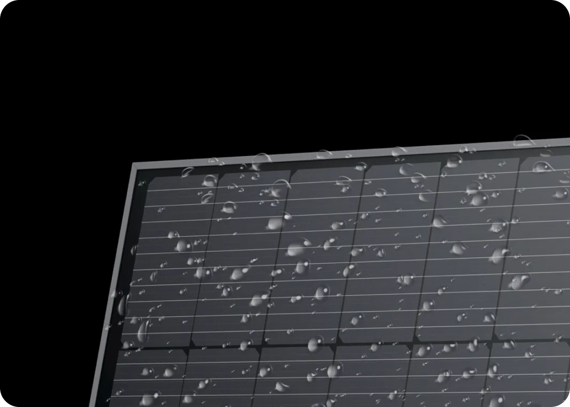 An EcoFlow rigid solar panel sporting an IP68 water and dustproof rating has water drops all over the surface.