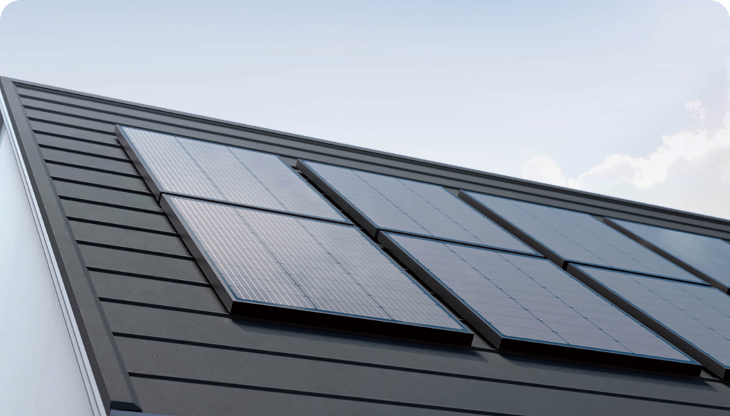 An array of EcoFlow 100W Rigid Solar Panels are mounted on a house's roof.